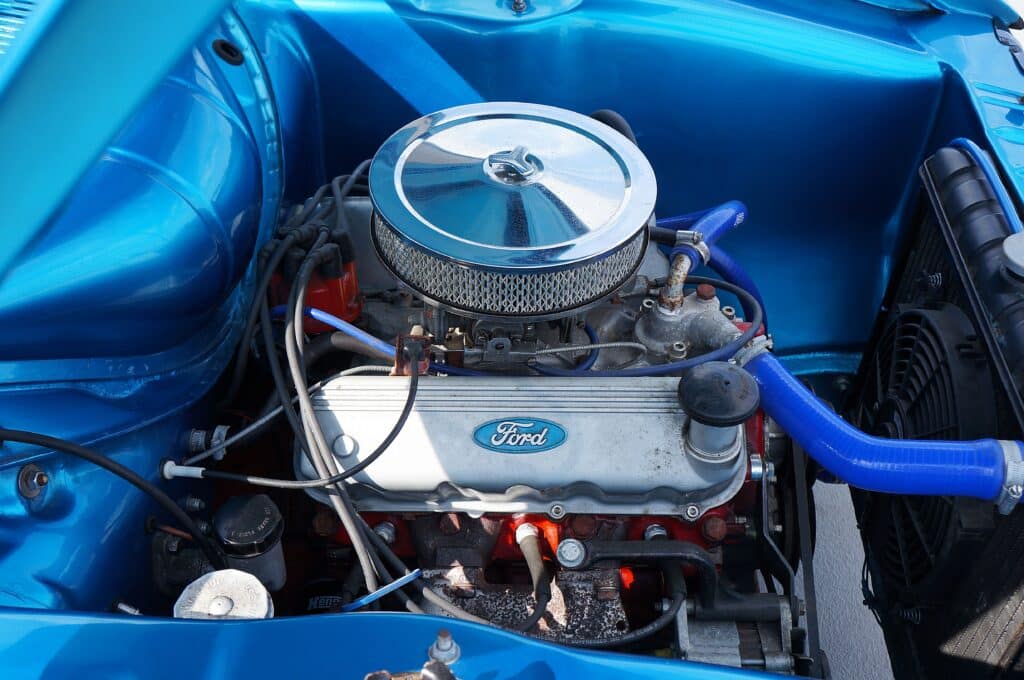 Detailed view of a Ford engine featuring blue elements, showcasing automotive engineering and design.